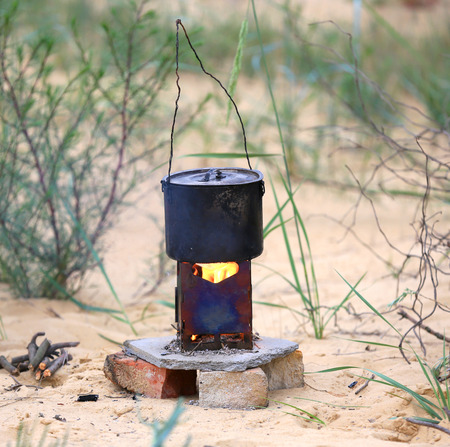 tourist kettle on portable heaterの写真素材