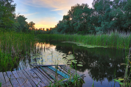 Nice summer sunset on riverの写真素材