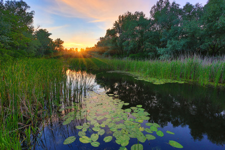 Landscape with nice sunset on riverの写真素材