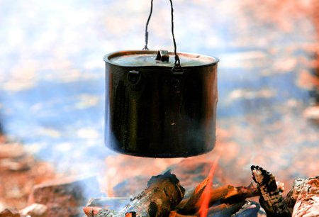 smoked tourist kettle over camp fireの写真素材