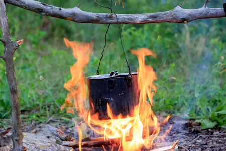 Tourist kettle on camp fire

の写真素材
