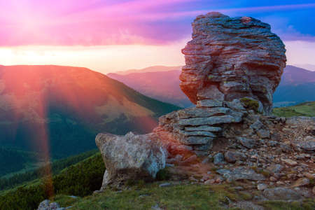 rock in mountains at sunset time