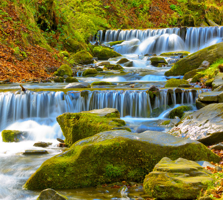 Nice scene with wterfall cascade on mountain riverの写真素材