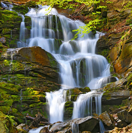 Scene with nice waterfall in Carpathiansの写真素材