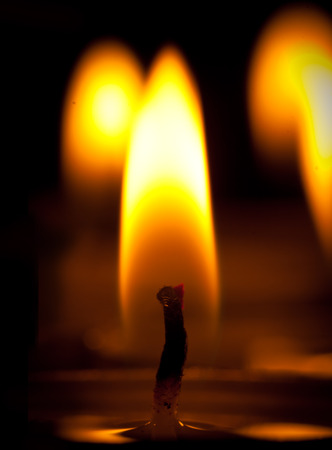 light of candle in darknessの写真素材