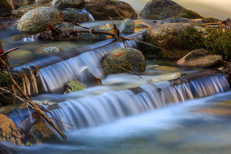Nice small waterfall  cascade on mountain riverの写真素材