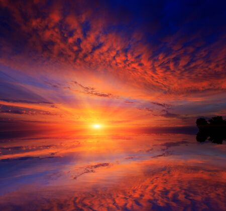 Nice sunset over water surfaceの写真素材