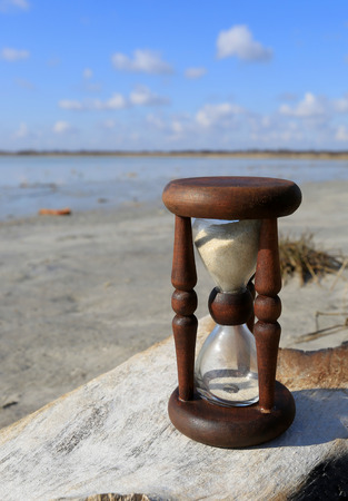Hourglass on wood in a outdoorの写真素材