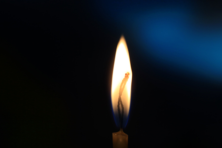 Flame of candle in darknessの写真素材