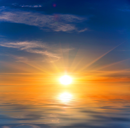 scene with sunset over water surfaceの写真素材