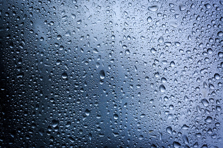 water drops on glass - abstract backgroundの写真素材