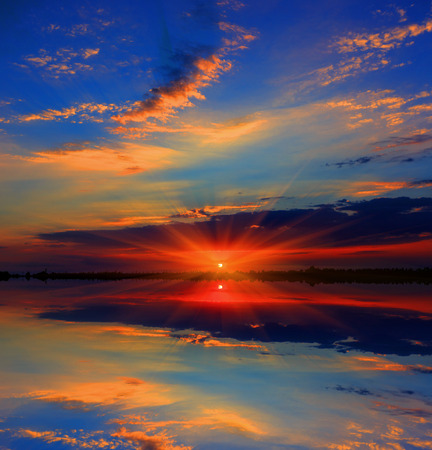 Nice majestic sunset over lakeの写真素材