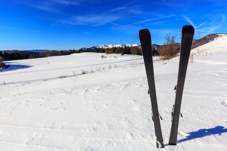 scene with mountain ski in snow on winter resortの写真素材