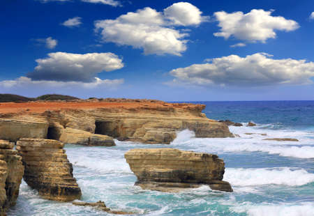 Landscape with rocks in sea at stormy dayの写真素材