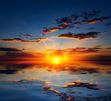 Nice sunset over water surfaceの写真素材