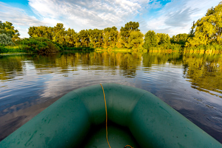 Boat on river in sunny mornigの写真素材
