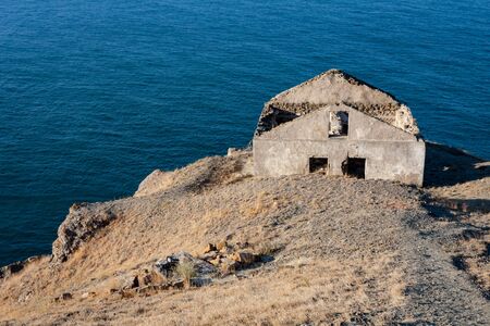 ods abandoned ruined house over seaの写真素材