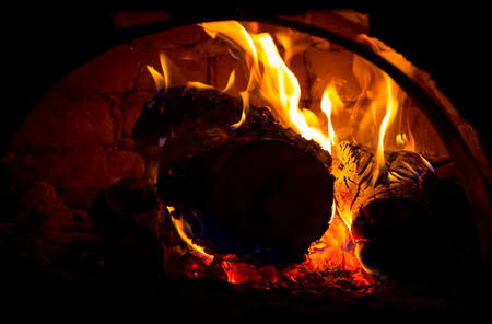 red hot embers in oven in darknessの写真素材