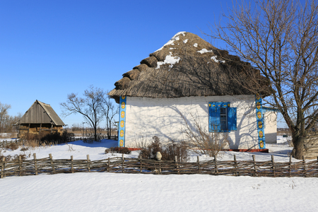 Traditional ukrainian old-style house with thatch roof の写真素材