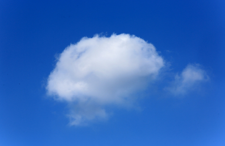 Nice alone white cloud in spring slyの写真素材