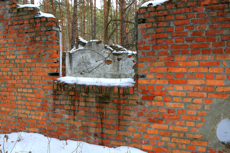 old broken building in forest in winter timeの写真素材