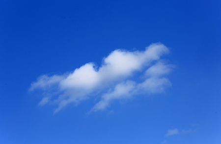alone white cloud in blue skyの写真素材