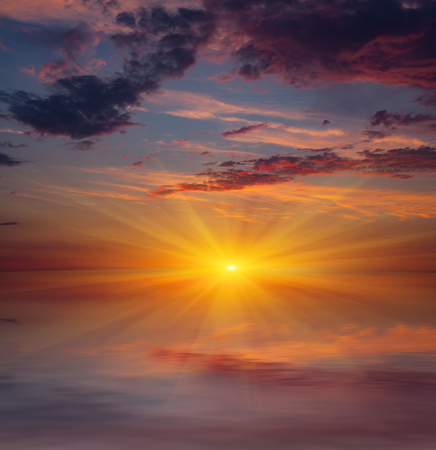 Nice sunset scene over water surfaceの写真素材