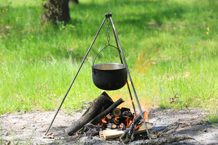 smoked tourist kettle over camp fireの写真素材