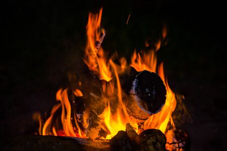 hot flames of fire in darknessの写真素材