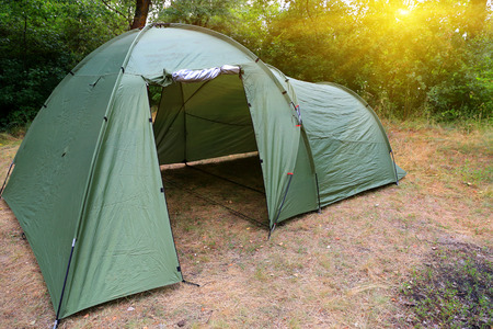 Tourist tent on meadow in forestの写真素材