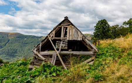 old wooden house in mountains, ruinの写真素材