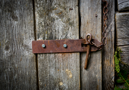 old wooden door and steel latchの写真素材