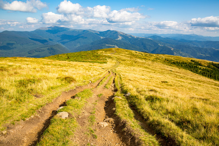 rut road over ridge top in Carpathian mountainsの写真素材