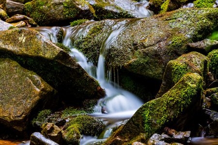 small waterfall on mountain steramの写真素材