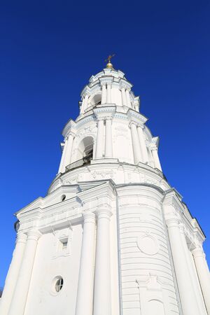 Bell tower Exaltation of the Cross Monastery on blue sky background. Poltava, Ukraineの写真素材