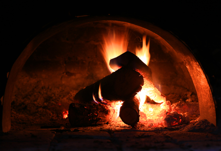 hot flames of burning woods in ovenの写真素材