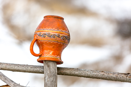 clay jugs on a wooden fence, Ukraineの写真素材