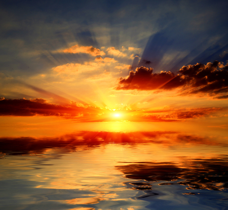 Abstract sunset over water surfaceの写真素材
