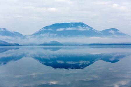 Tranquil morning landscape with mountain lakeの写真素材
