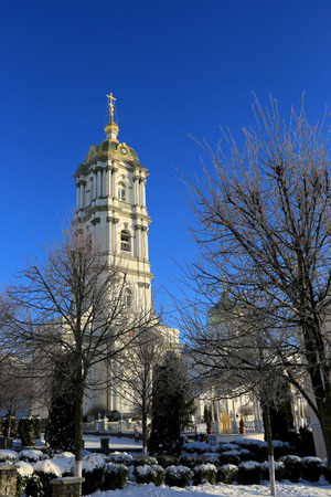 bell tower of the Holy Dormition Pochayiv Lavra in the morning sunlight, Ukraineの写真素材