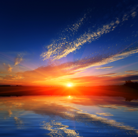 nice hot sunset over water surfaceの写真素材