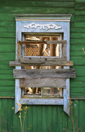 old wooden window in lost aged rural houseの写真素材