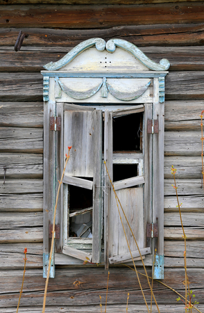 Old wooden windows in lost rural houseの写真素材