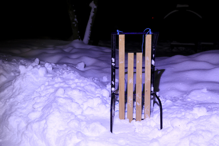 Abstract sled on snow lighted in nightの写真素材