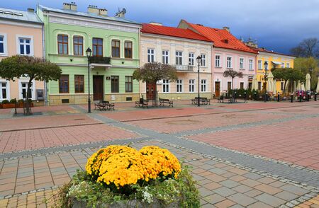 View on flowers in main place in town - 11 03 2019: square in Sanok town, Poland, Europe