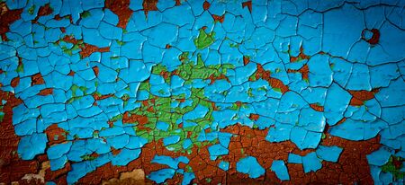 Abstract background with old cracked paint on a wooden surface