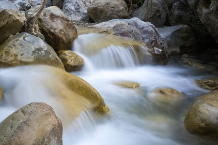 landscape with waterfall on mountain river. Long time exposition photo