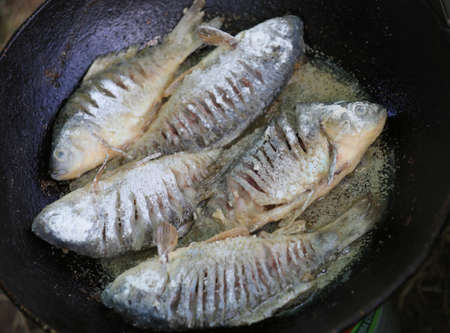 Fresh fish fried in a pan, delicious food
