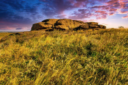Evening landscape with stone in steppeの写真素材