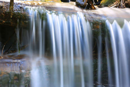 water stream of small waterfallの写真素材